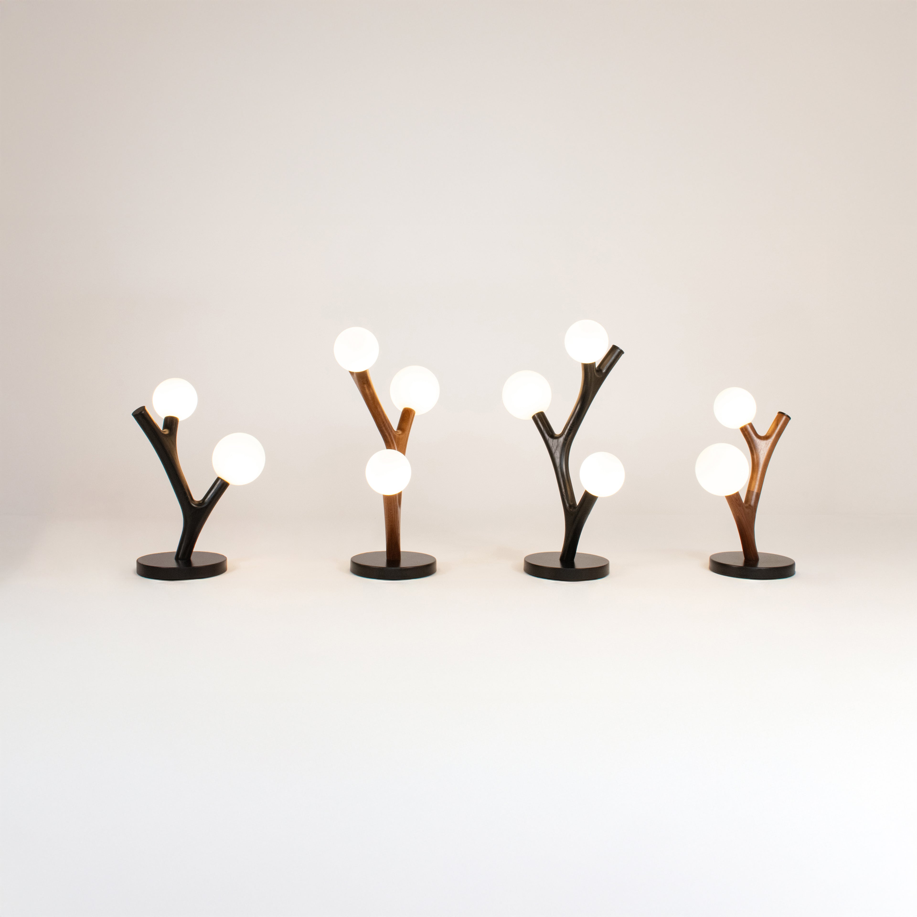 Set of 4 unique chaparral table lamps with branch-like design on a plain background