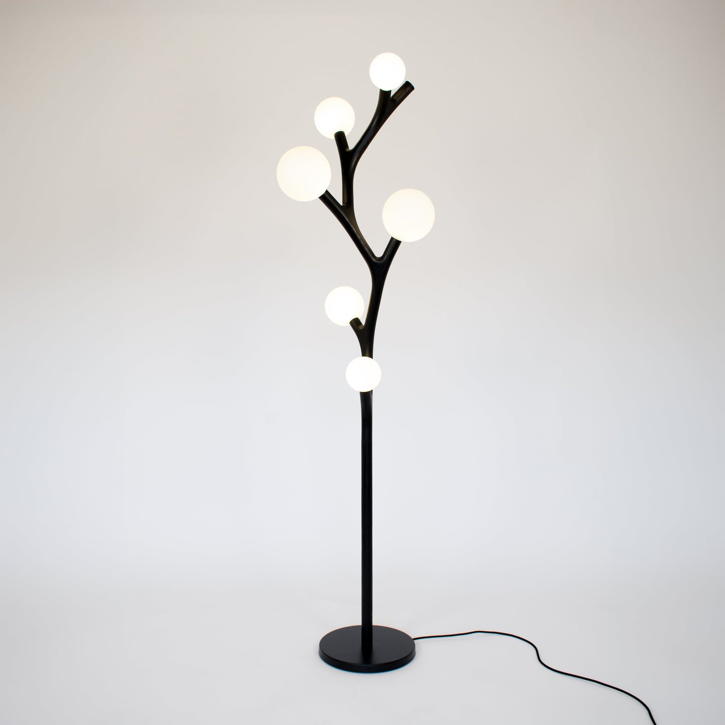 Chaparral handmade floor lamp with multiple whimsical spherical lights on a white background