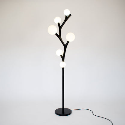Chaparral handmade floor lamp with multiple whimsical spherical lights on a white background