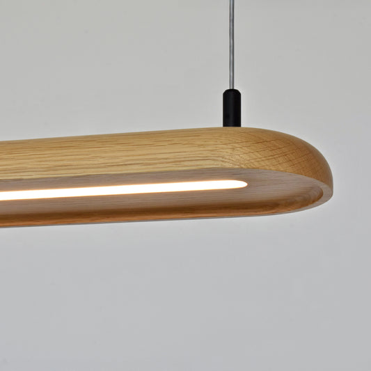 Wooden pendant light with a modern design on a plain background